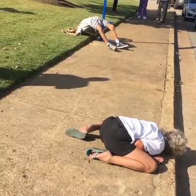  Passers-by stopped to film and photograph the unconscious couple