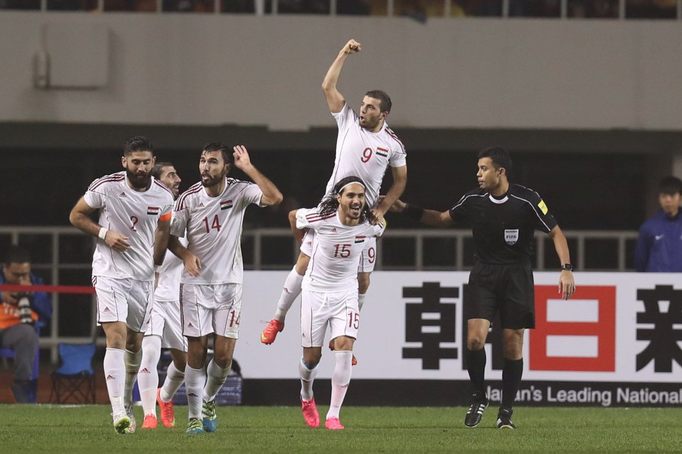  Syria celebrate their winning goal against China in Xi'an