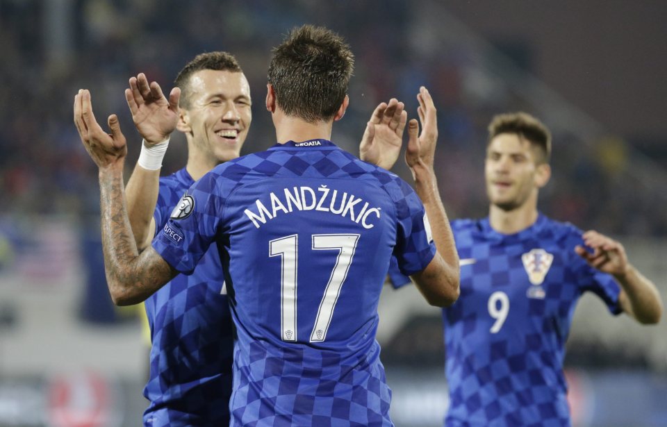  Mandzukic celebrates his hat-trick against Kosovo with his Croatia team-mates