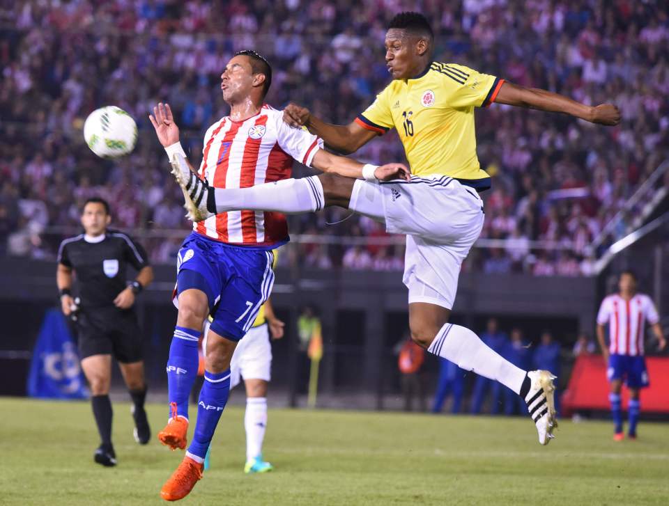  Yerry Mina is quickly on hand to close down his man in clash with Paraguay