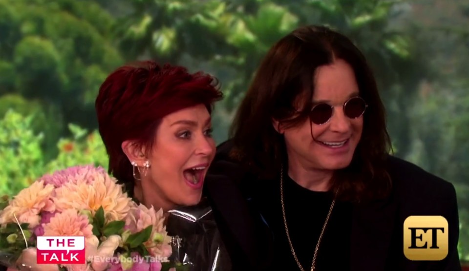  Back in the game ... Ozzy earns brownie points by surprising wife Sharon with flowers on US show The Talk