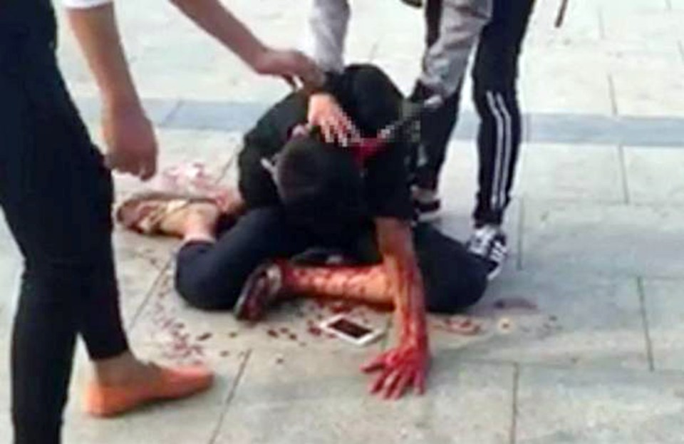  Gruesome ... Man is seen slumped on the ground with a huge dagger stuck in his head