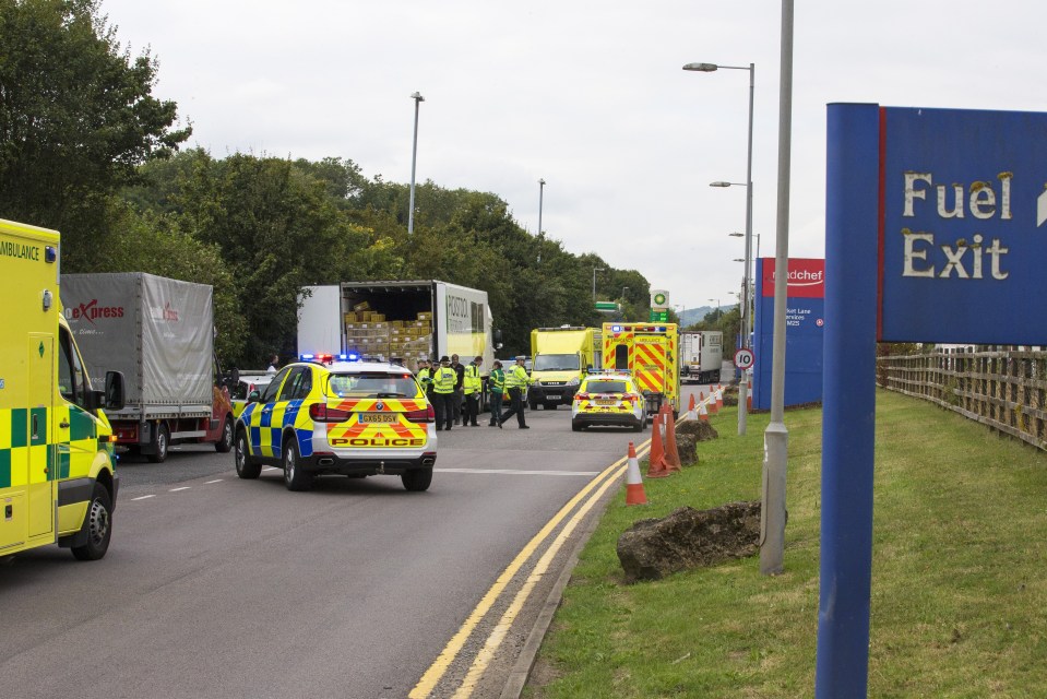  Police shut off part of the road into the service station upon discovering the suspected migrants