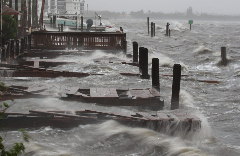 Heavy waves caused by Hurricane Matthew pound boat docks on Cocoa Beach, Florida. Officials warned that dangerous storm surges were still a danger in the Carolinas