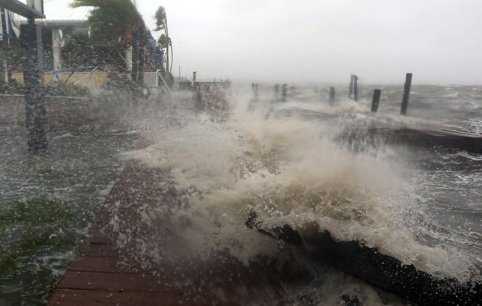  Waves from the Banana River smash into restaurants lining Florida's east coast