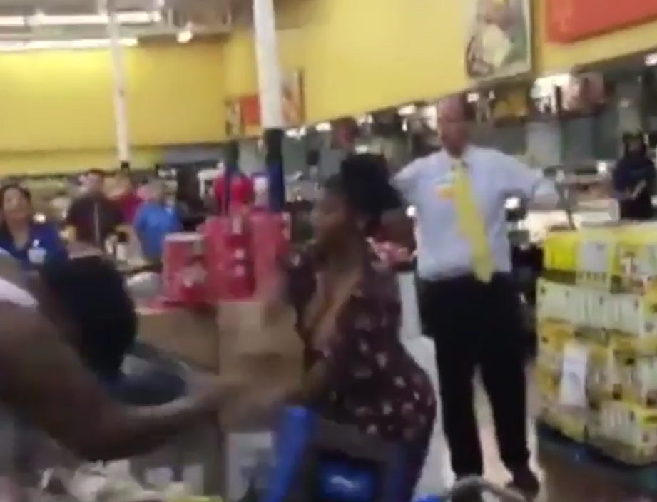 It ended when the woman in the purple dress gave up and resorted to throwing store items at her opponent