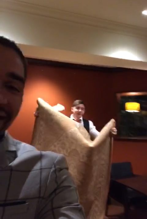  Louis Smith laughs as his pal holds rug