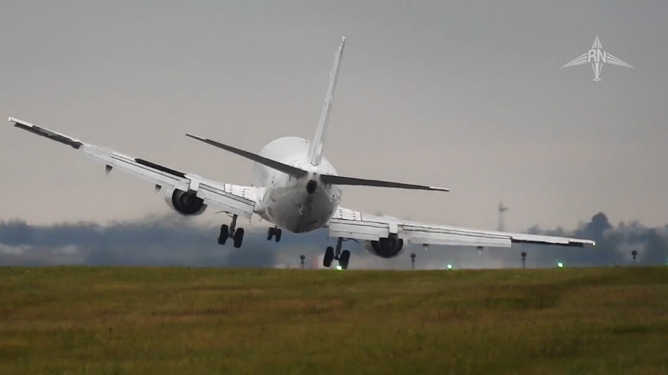  The right wing dips as the plane lands forcing the pilot to rebalance in strong winds