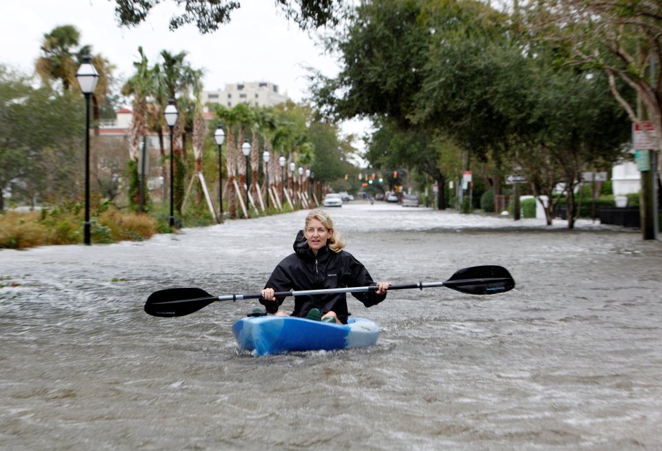  A Charleston resident kayaks down a flooded Rutledge Avenue after Hurricane Matthew hit Charleston, South Carolina