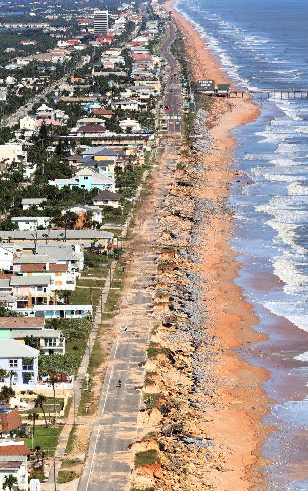  Debris lies on a portion of the damaged A1A Highway which was closed in Flagler Beach, Florida