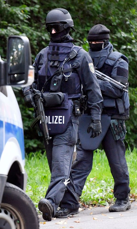  Armed police are pictured outside Albakr's flat