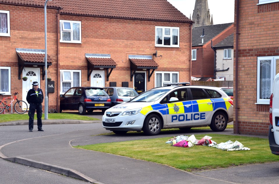  Tributes left at the home where Elizabeth and Katie Edwards were brutally murdered