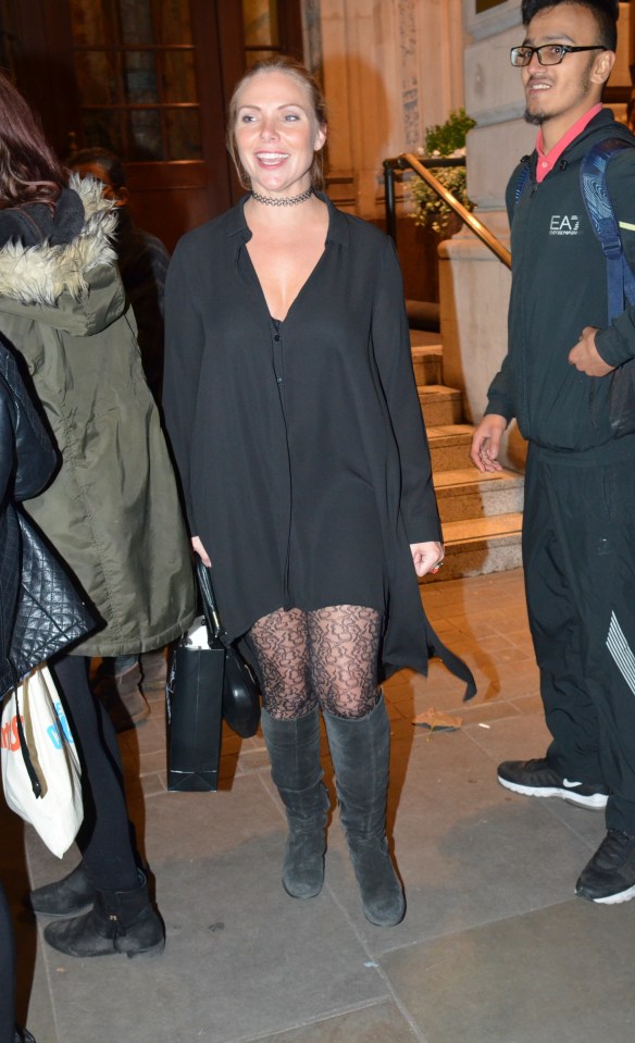  Samantha Womack wore an all-black ensemble including patterned tights and a choker