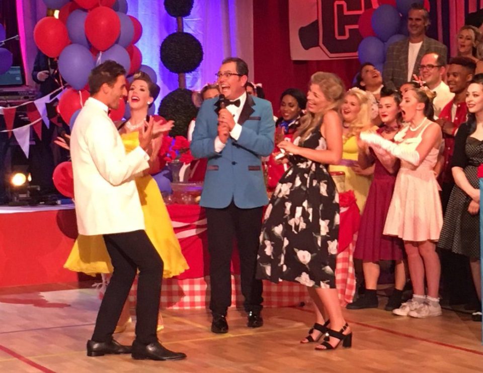 Arnie jokes around with comedian Katherine Ryan on Alan Carrs Grease Night