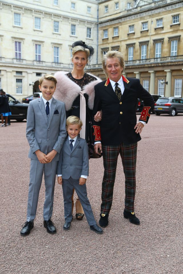  Rod Stewart at Buckingham Palace with wife Penny Lancaster and their sons Aiden and Alastair (left)