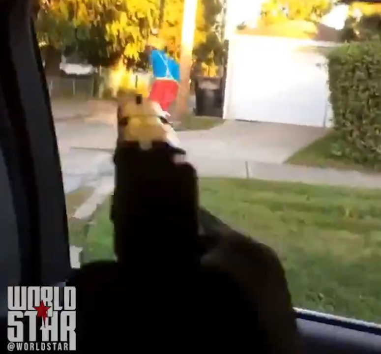  One of the men pulls a gun and aims it at the clown