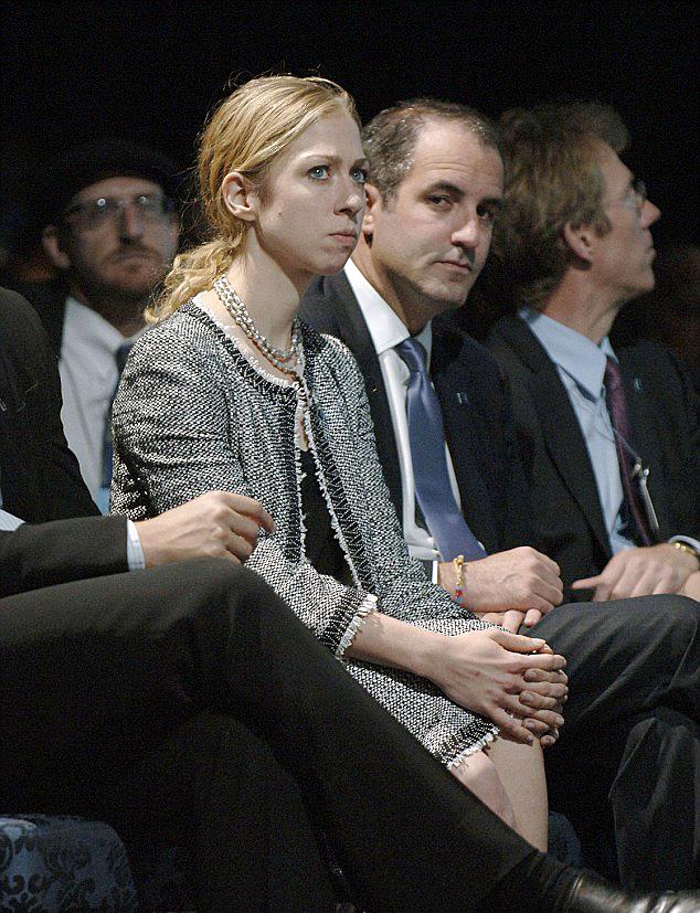  Chelsea Clinton sitting next to Doug Band who called her a 'spoiled brat' in an email