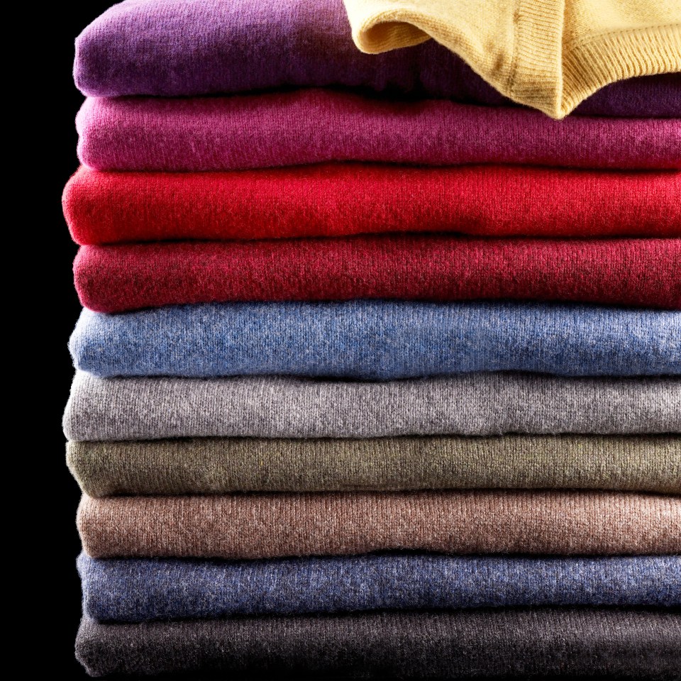 stack of v neck sweater/jumpers