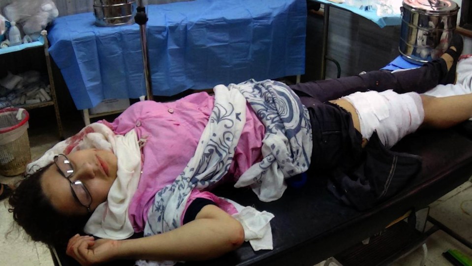  An injured schoolgirl lies in a hospital in Daraa, Syria following a blast