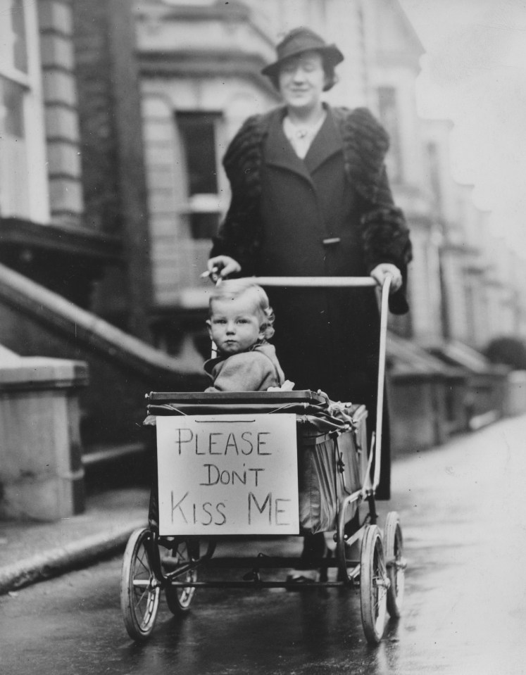 Woman Pushing Baby In A Stroller