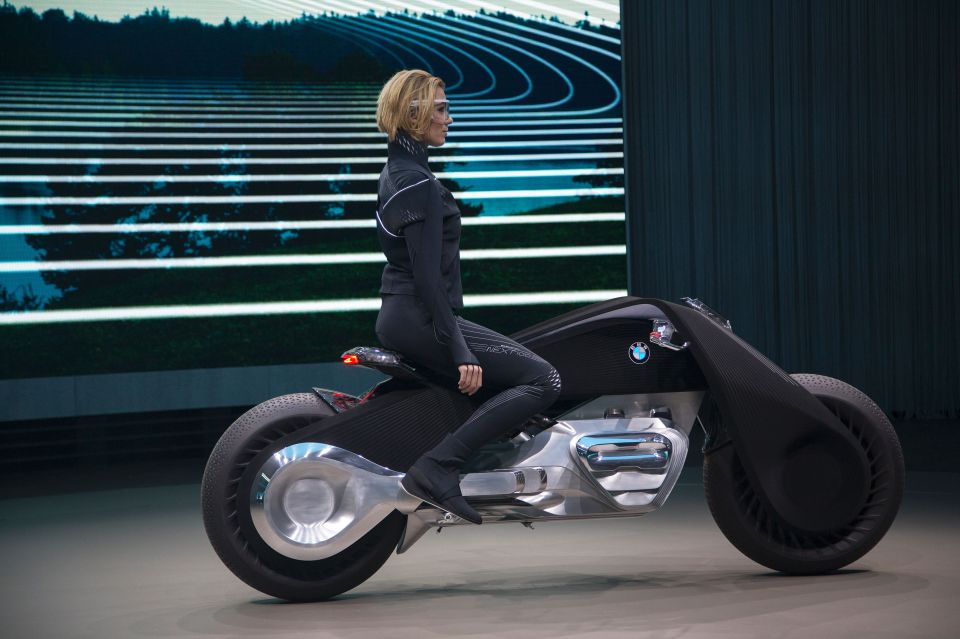  A rider demonstrates how the bike stays standing with her feet still in the riding position even when static