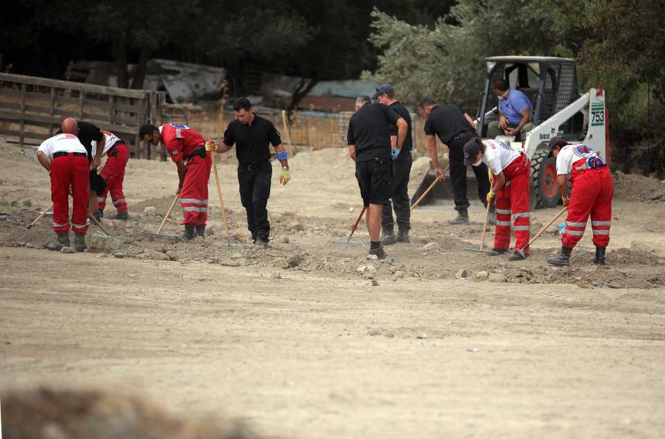  Specialist search officers go through rubble by the farmhouse where Ben Needham disappeared from in Kos, Greece