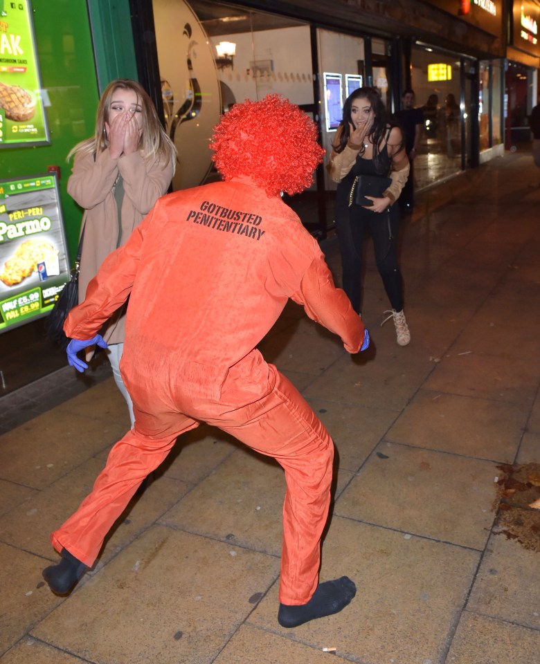  The girls scream as the 'killer clown' appears out of nowhere