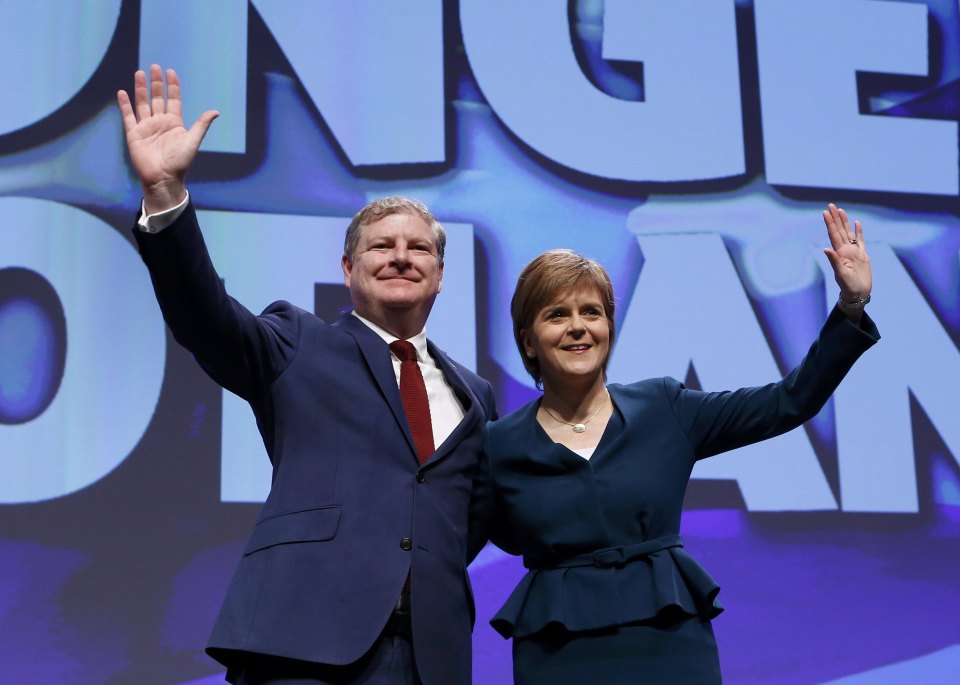  Scotland's First Minister and leader of the Scottish National Party (SNP), Nicola Sturgeon, waves with deputy leader Angus Robertson, at the party's annual conference in Glasgow