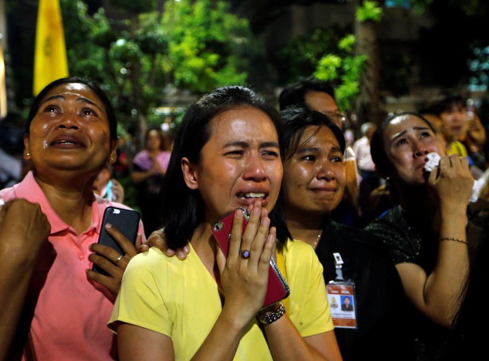  Well-wishers weep outside Bangkok's Siriraj hospital where the King was being treated