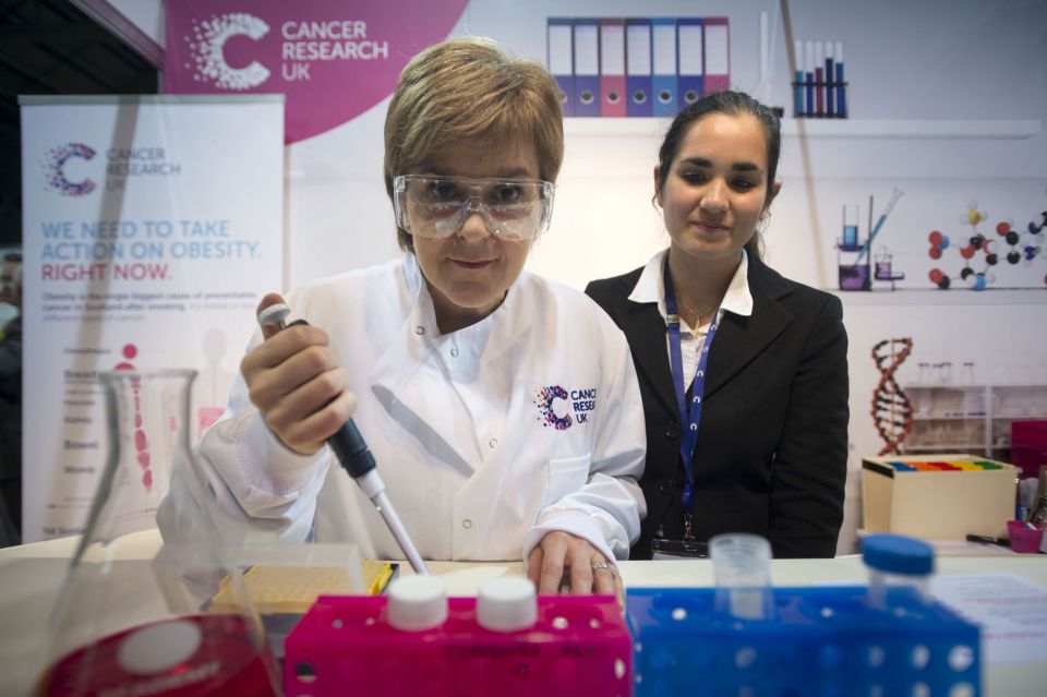  Nicola Sturgeon donned a lab coat and safety goggles for her visit to the Cancer Research stall at the SNP conference