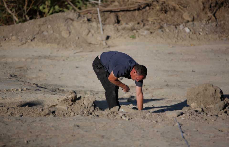  A forensic archaeologist works at the second site in Kos, Greece