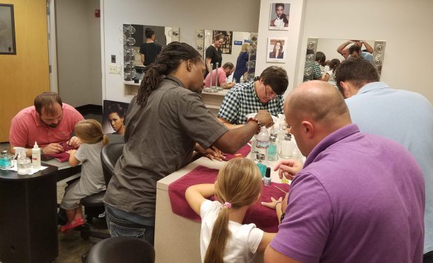 But it's not just about learning how to do hair and nails, it is also an opportunity for dads to bond with their daughters