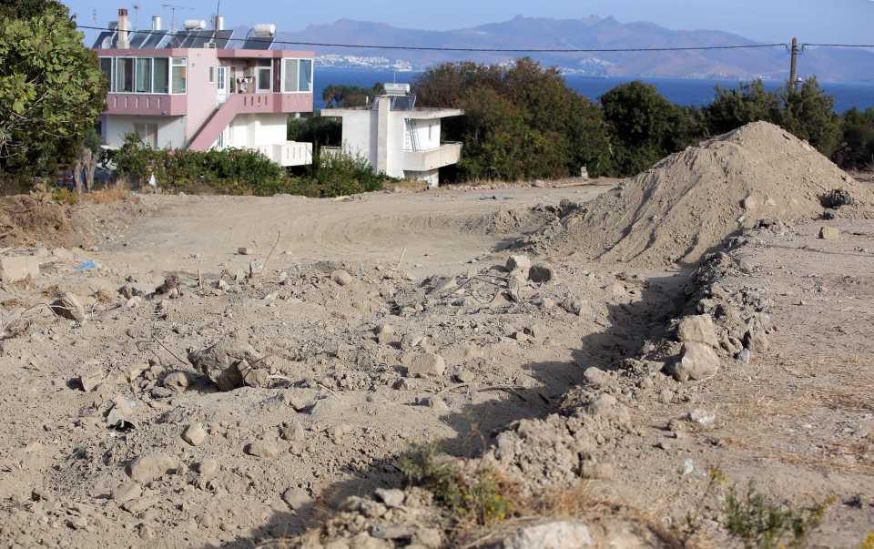  Mounds of rubble left at the site of the second search for Ben