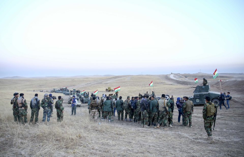  Peshmerga forces stand guard at Hazer region's Wardak village as operations to retake the city began last year