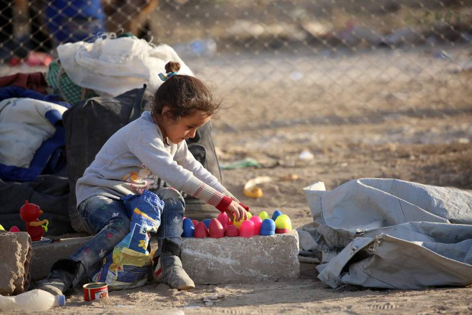  Suffer the children... A child plays at a refugee camp housing Iraqi families who fled Mosul