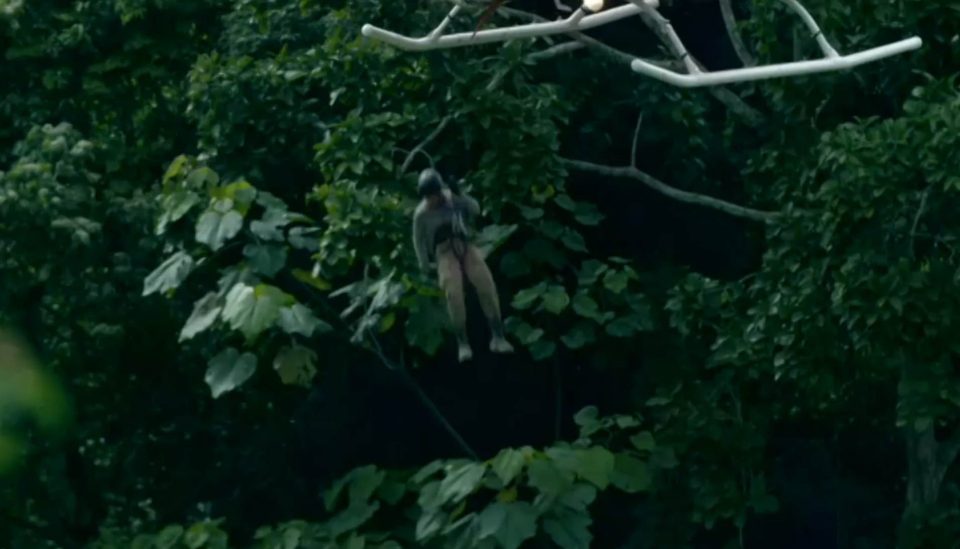 Efrem dangles from a helicopter in the Ecuadorian jungle