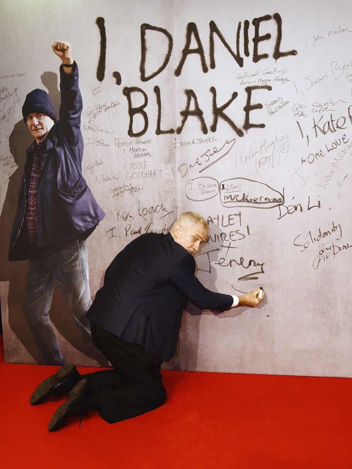 Jeremy Corbyn won't kneel for the Queen... but he was on bended knee to sign a poster at leftie director Ken Loach's premiere