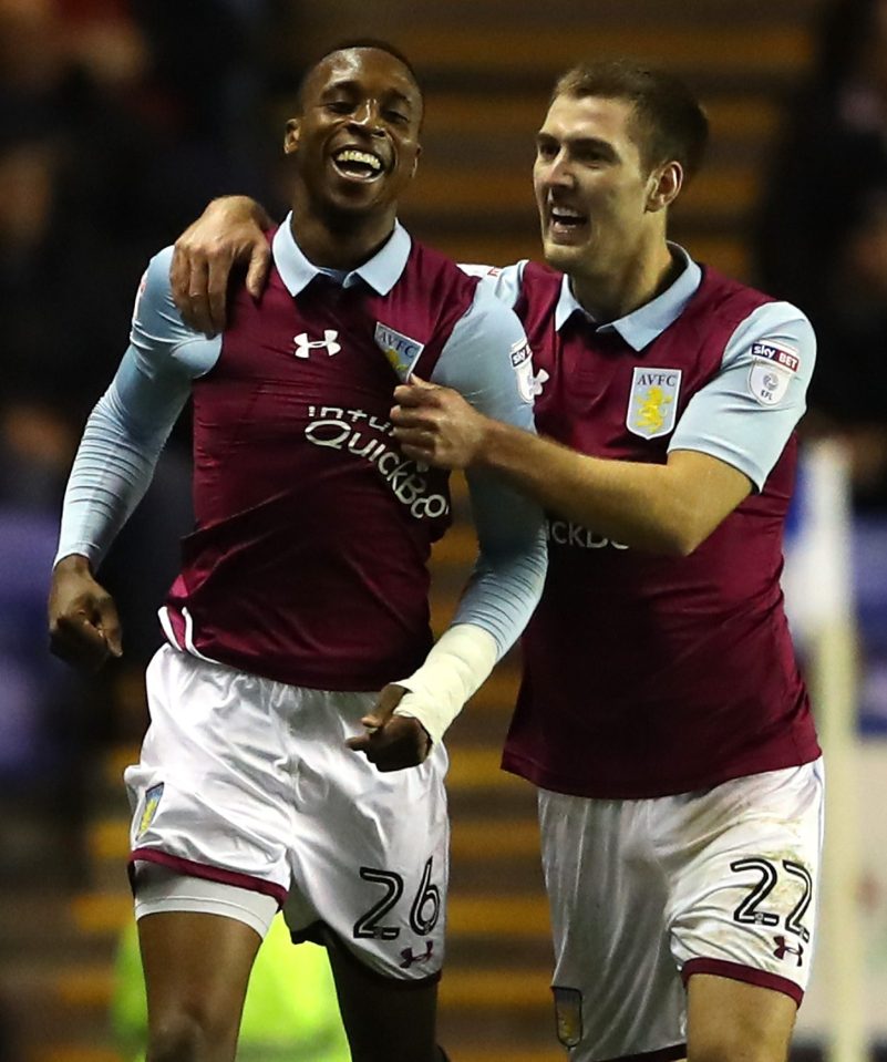  Nice one...Jonathan Kodjia is congratulated by Villa team mate Gary Gardener after opening the scoring