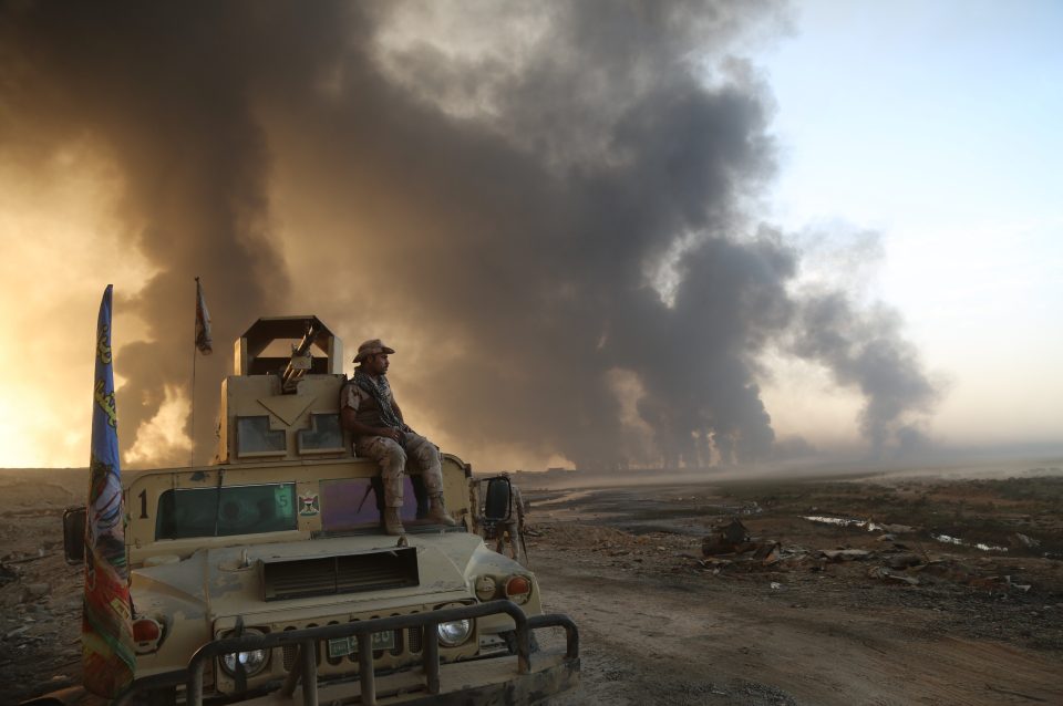  The militants have set fire to oil fields to provide cover against airstrikes