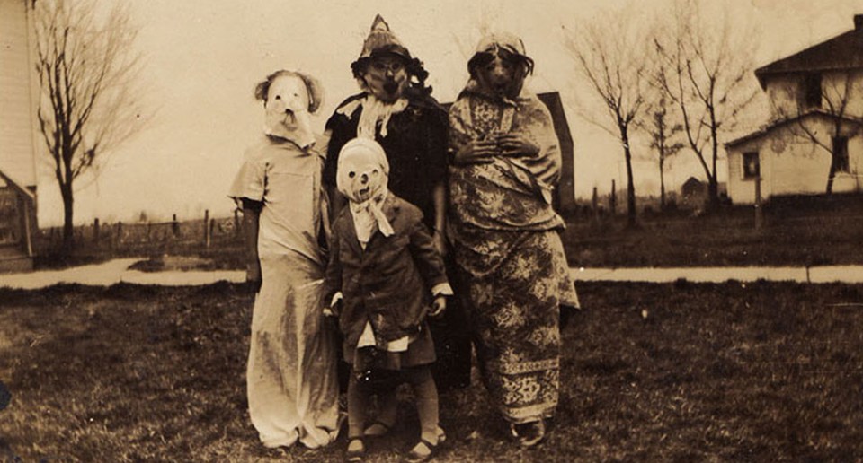  A family wears chilling masks with holes cut out