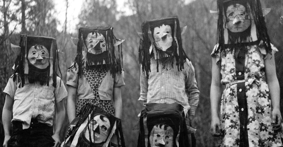  A group wears elvish-looking headdresses complete with pointed ears and long hair