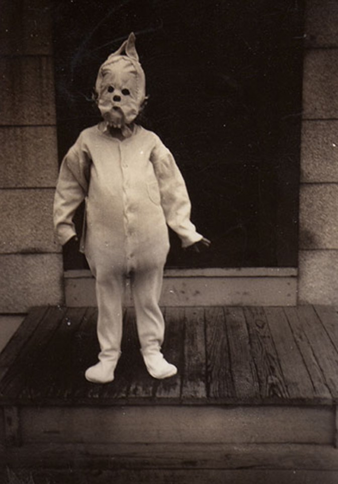  One petrifying image shows a baby wearing a ghoulish mask