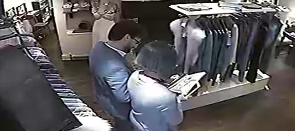  Caught on camera . . . in boutique where he met Carolyn