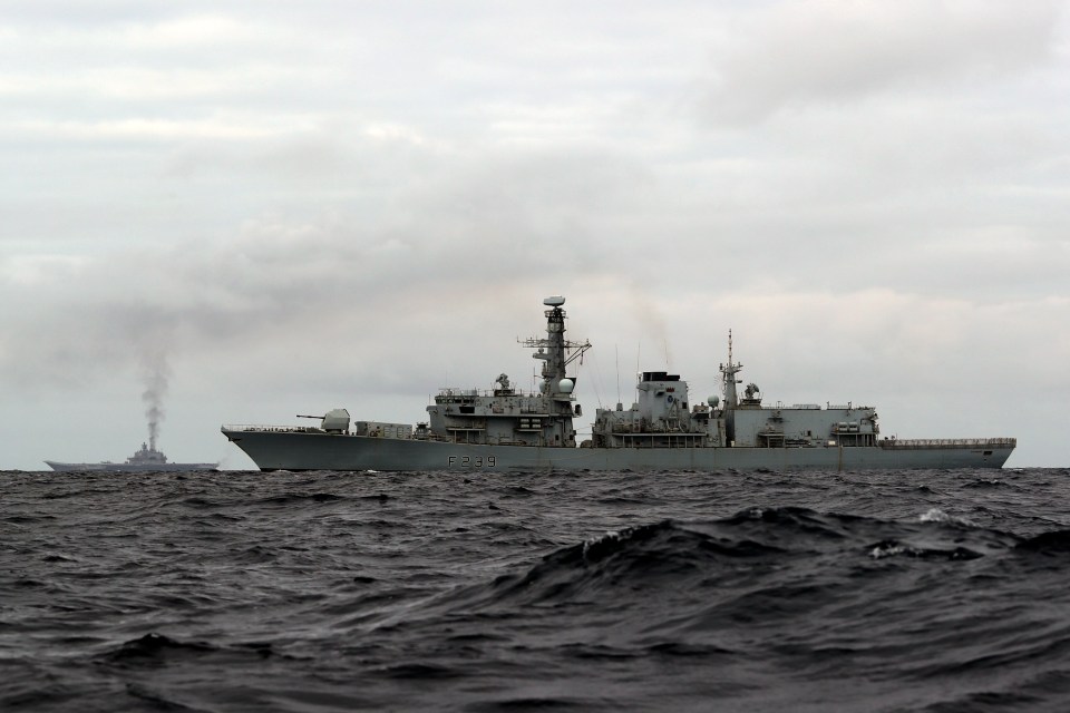  They will follow the fleet all the way down the North Sea, into the English Channel and on to the Straits of Gibraltar. The Admiral Kuznetsov can be seen in the background billowing smoke