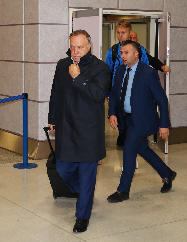  Dick Advocaat leads his Fenerbahce side into the terminal at Manchester Airport