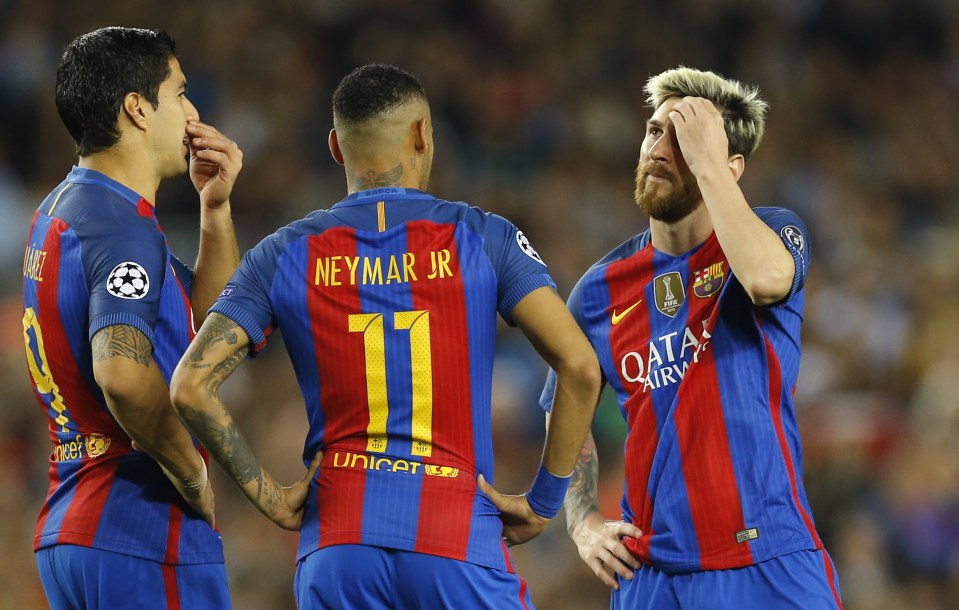 Barcelona's Luis Suarez, Neymar and Lionel Messi talk before taking a free kick during a Champions League, Group C soccer match between Barcelona and Manchester City, at the Camp Nou stadium in Barcelona, Wednesday, Oct. 19, 2016. Barcelona won 4-0. (AP Photo/Francisco Seco)