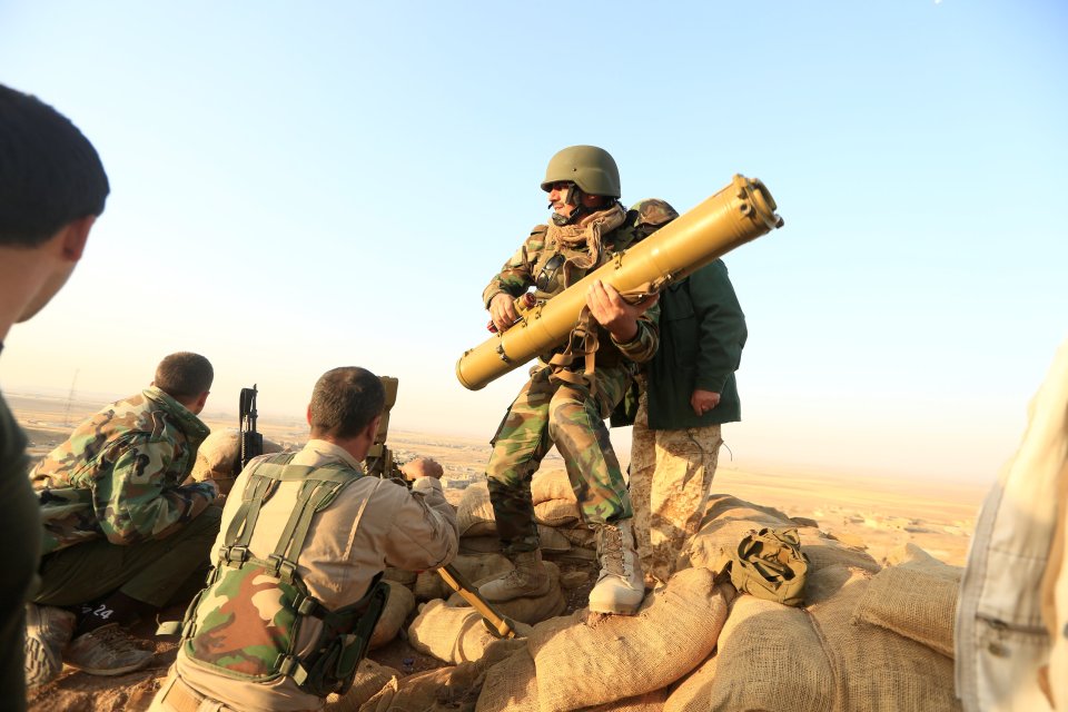  A Kurdish peshmerga soldier loads an anti-tank missile during this morning's skirmishes