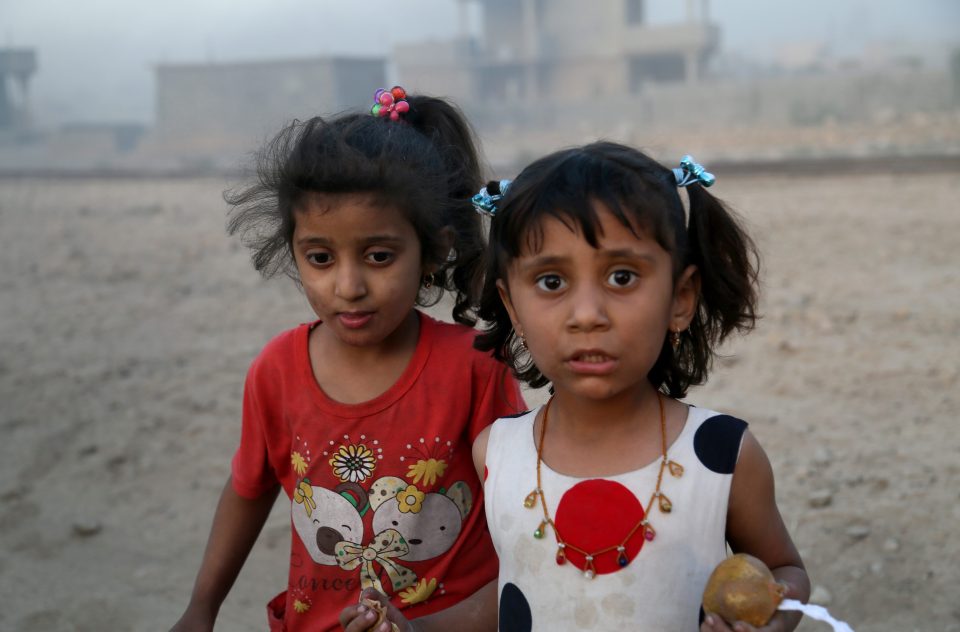  Two girls arrive in the town of Al Qayyarah after it was liberated from ISIS