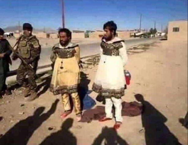  Two men dressed in drag are photographed by peshmerga forces near Mosul