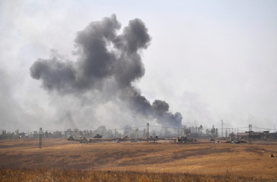  Smoke rises from a combined aircraft, artillery and ground attack to recapture the village of Tiskharab near Mosul